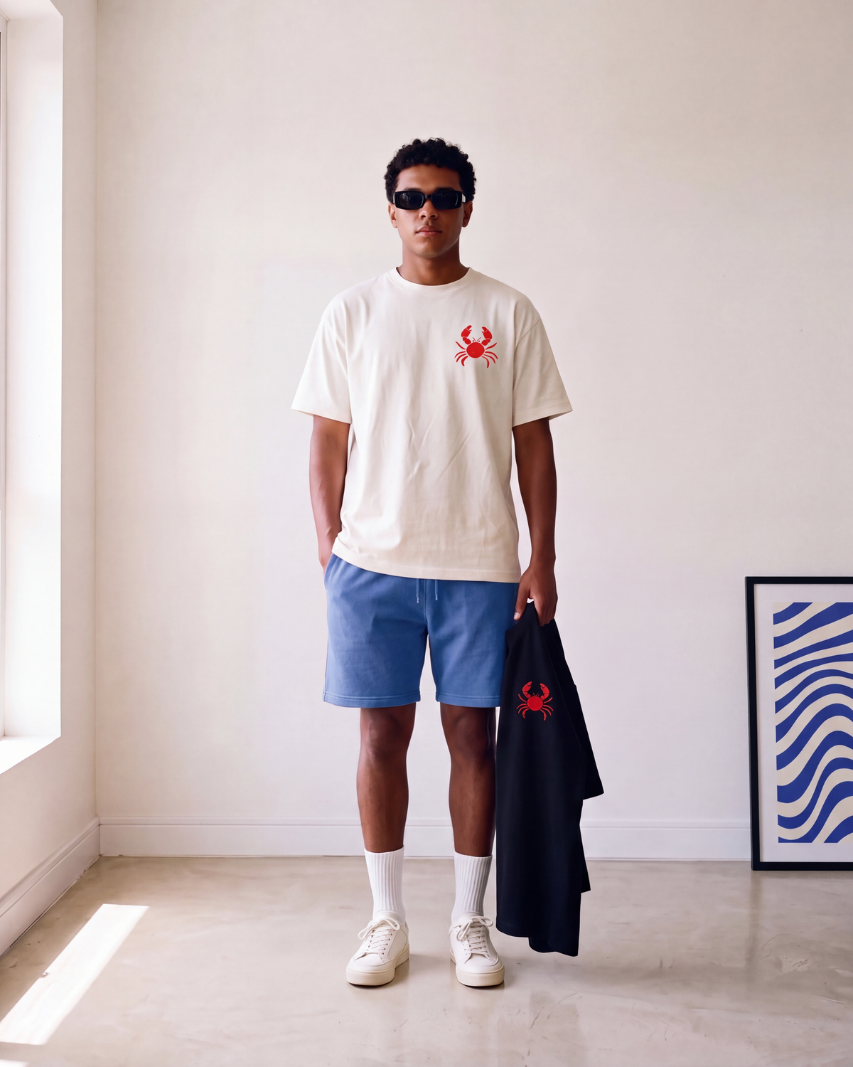 Crab State of Mind tee by Meilo held in hand — Egyptian streetwear, 100% Egyptian cotton