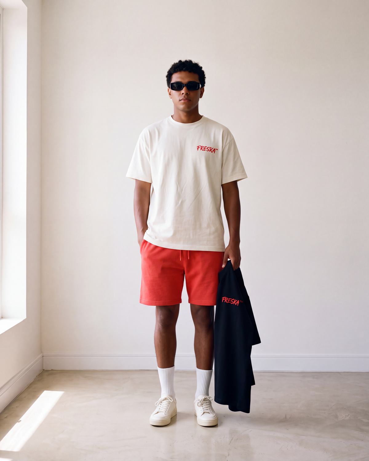 Freska tee by Meilo held in hand — Egyptian streetwear, 100% Egyptian cotton