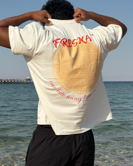 Freska oversized tee by Meilo in white — waffle ice cream back print, worn by the sea, Egyptian streetwear