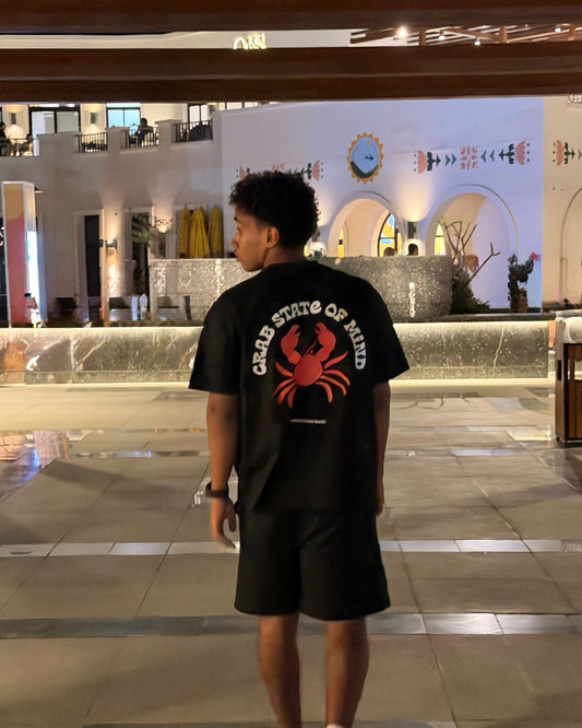 Crab State of Mind oversized tee by Meilo in black — red crab back print worn on a night out, Egyptian streetwear